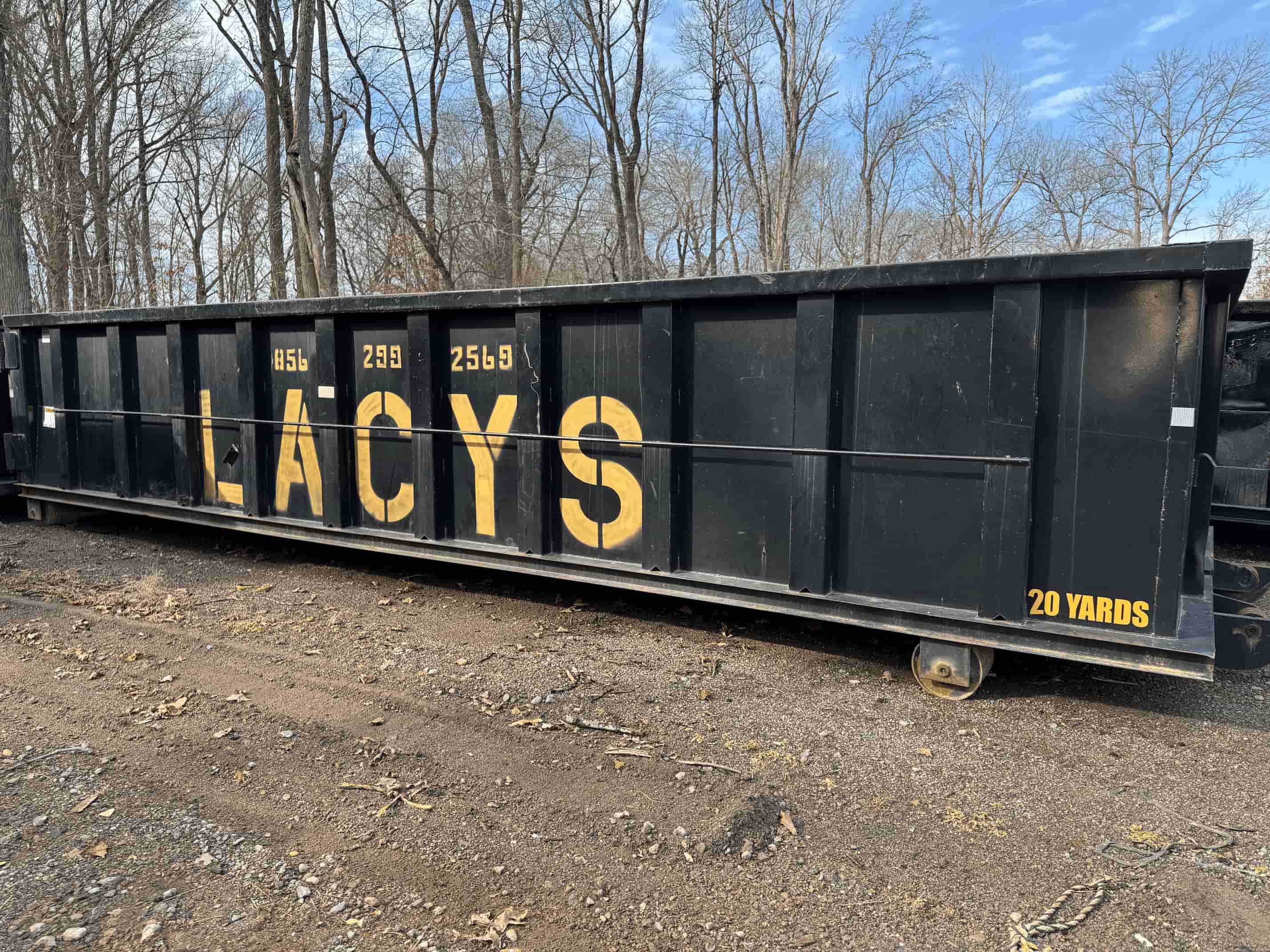 A black 20-yard roll-off dumpster