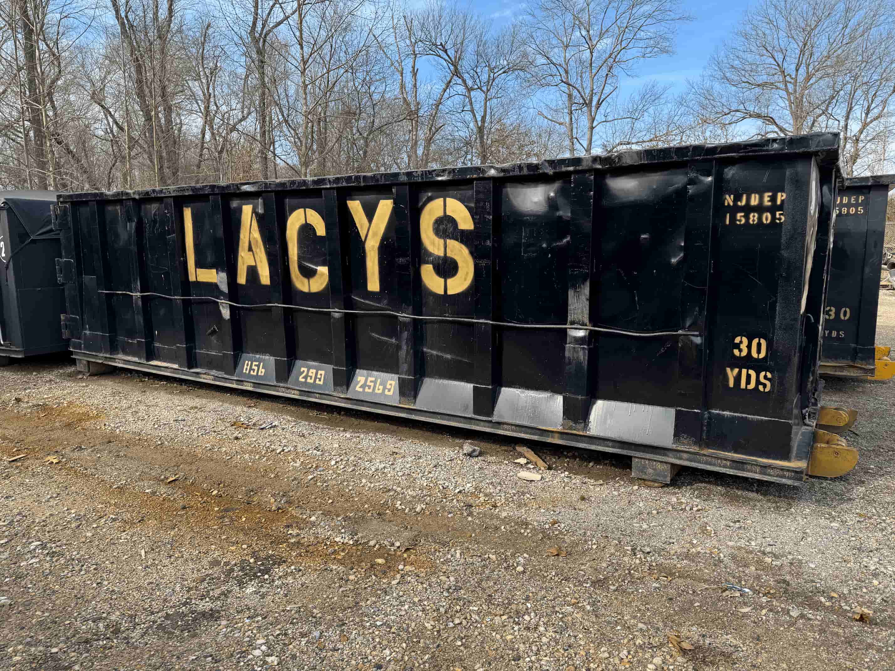 A black 30-yard roll-off dumpster